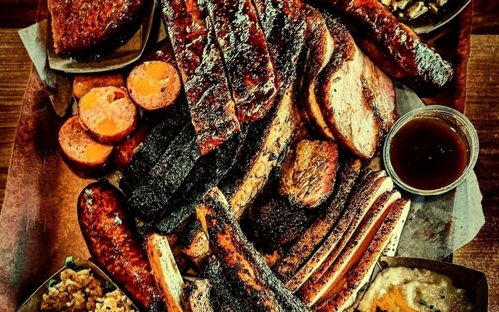A full spread of GW's BBQ brisket, ribs, sausage and sides for a party or event