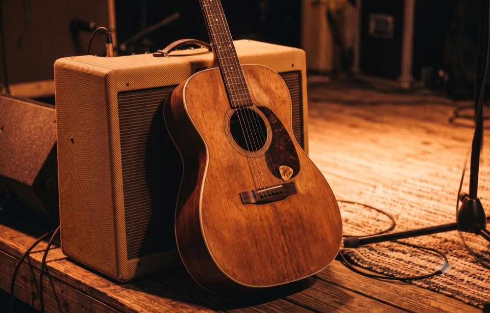 Acoustic guitar and amp on the patio stage at GW's BBQ